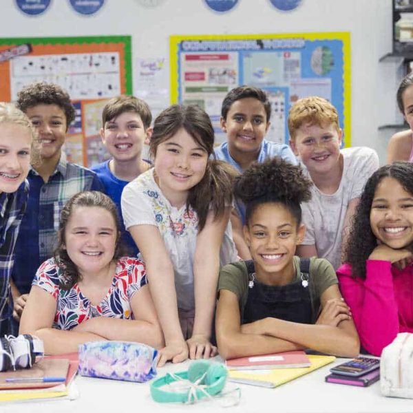 portrait-confident-junior-high-school-students-in-classroom-CAIF22925